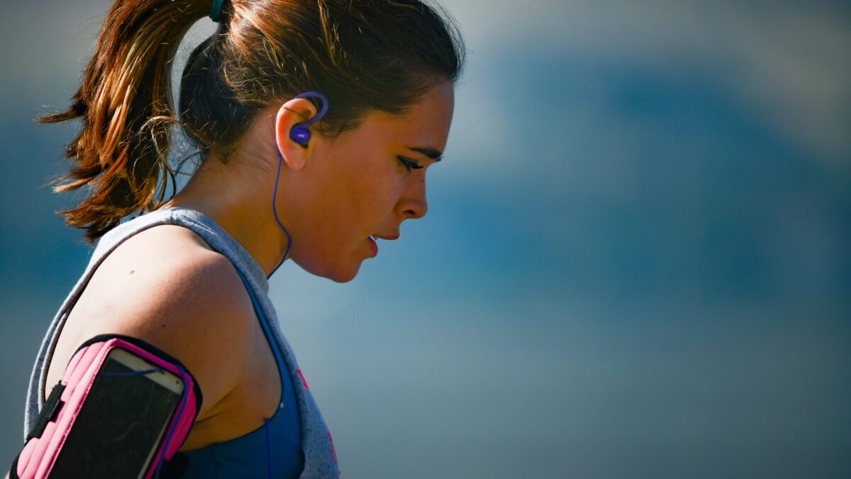 woman enjoys the benefits of exercise for managing negative mental health symptoms after run